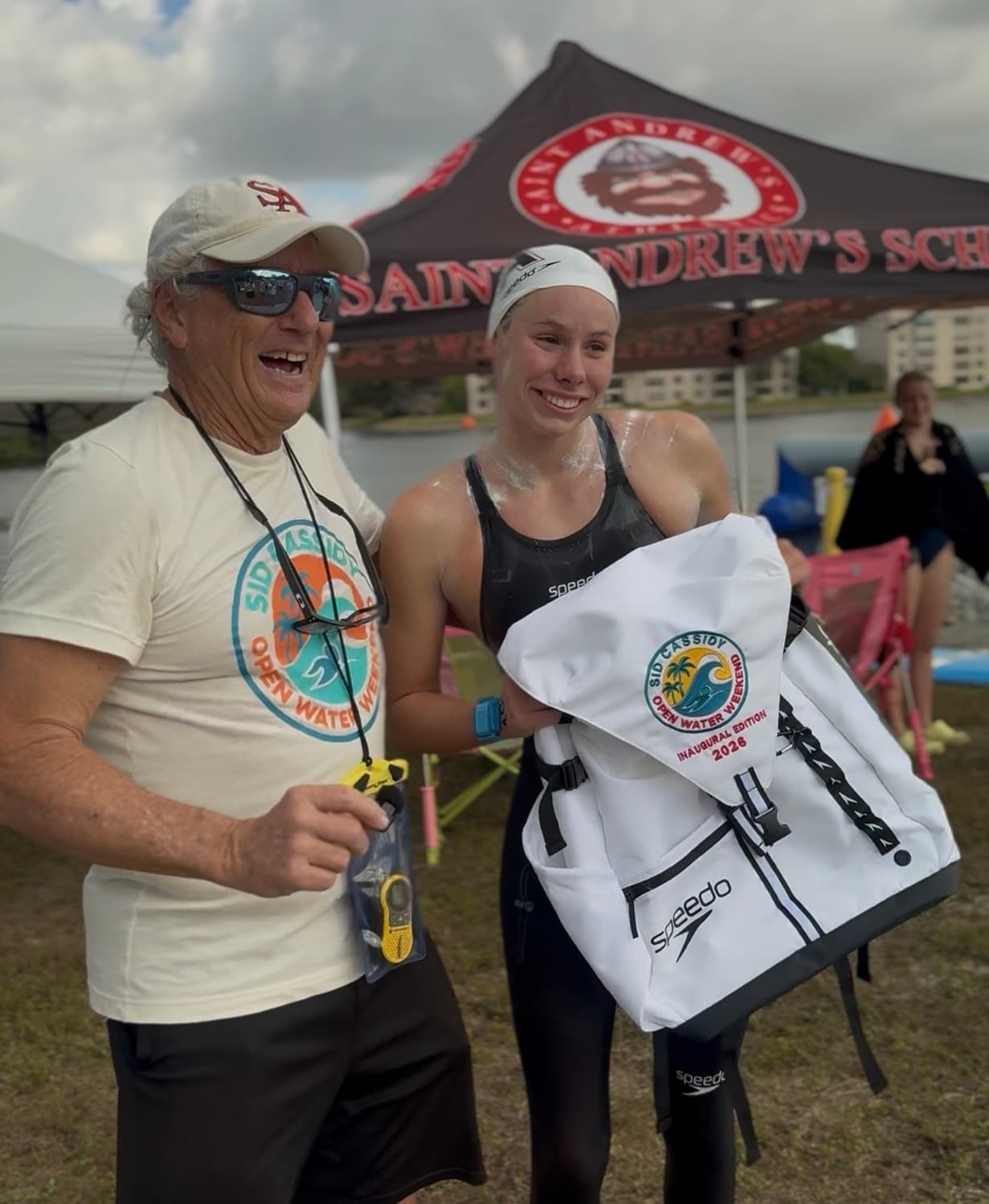 Coach Sid Cassidy presents women's champion Brinkleigh Hansen with her inaugural-edition prize